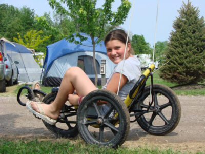 Pedal Kart Rentals at Jellystone Park™ South Haven Child riding pedal kart at Jellystone Park™ South Haven campground