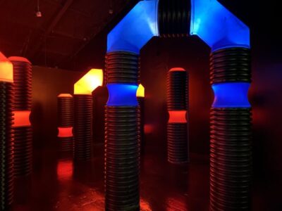 Indoor Laser Tag Arena at Jellystone Park™ Indoor laser tag arena at Jellystone Park™ with glowing obstacles and play structures