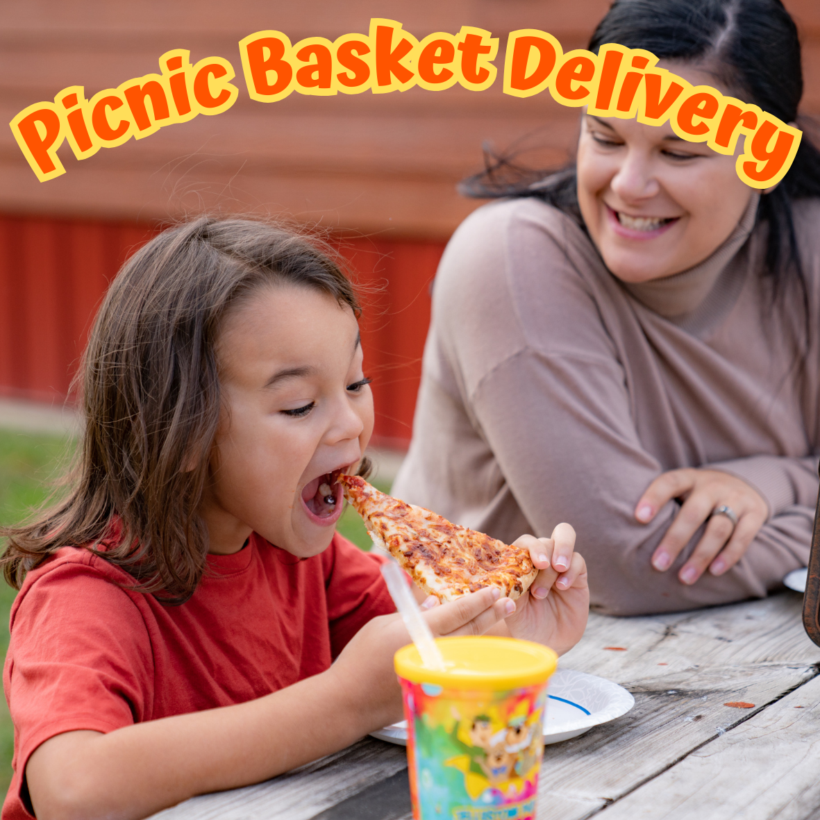 Picnic basket delivery experience at Jellystone Park South Haven Child enjoying pizza from a picnic basket delivery at Jellystone Park South Haven