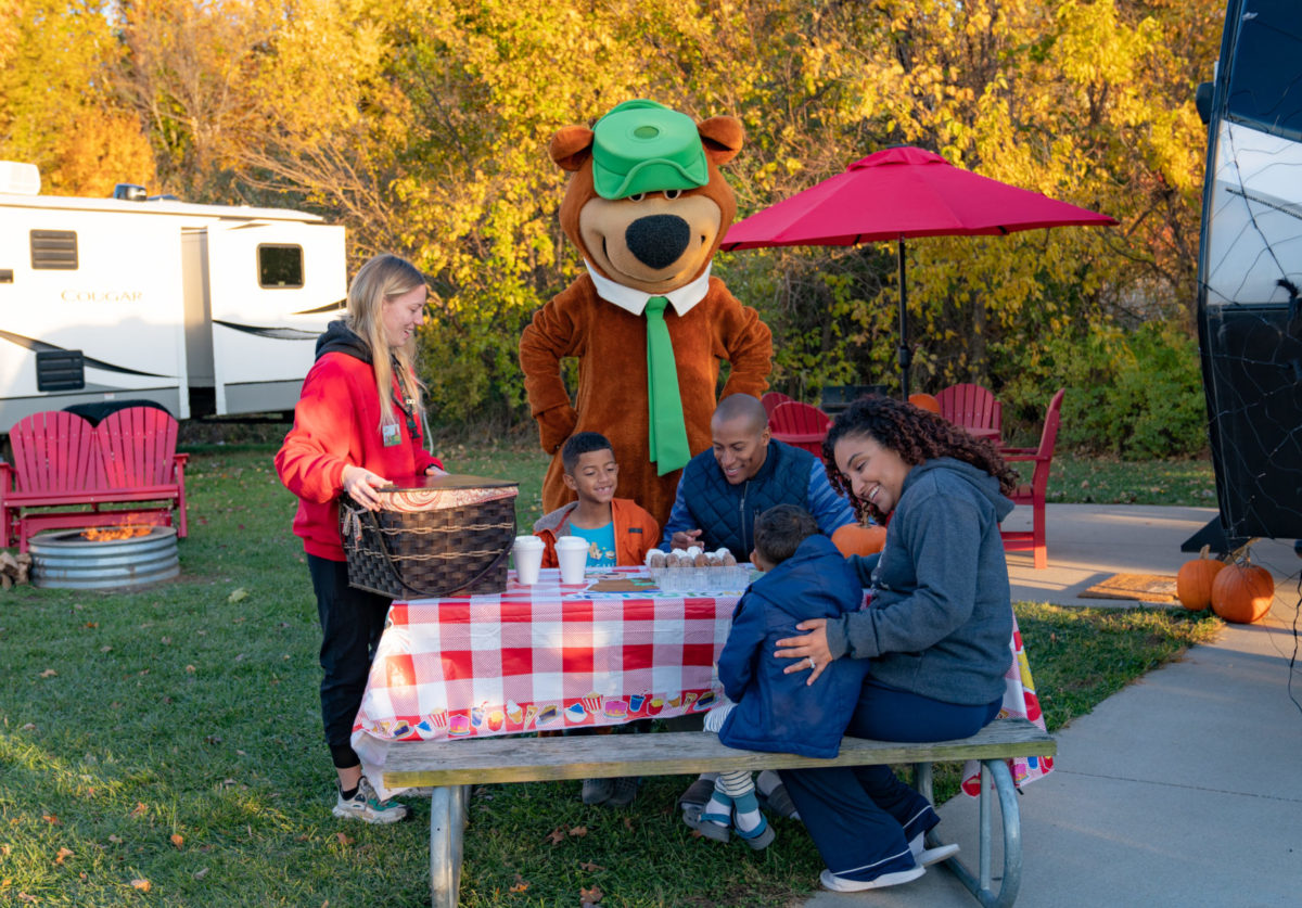 Yogi Bear campsite visit and picnic delivery at Jellystone Park South Haven Yogi Bear visiting a family at their campsite picnic table at Jellystone Park South Haven